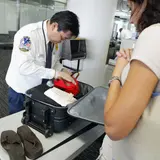 How Much Money Is Left Behind In TSA Bins Every Year? Where Does The Money Go? What About All The Snow Globes, Guns And Grenades?
