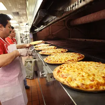 One Guy Supplies Cheese To Domino's, Pizza Hut, Papa John's… And It's Made Him A Multi-Billionaire