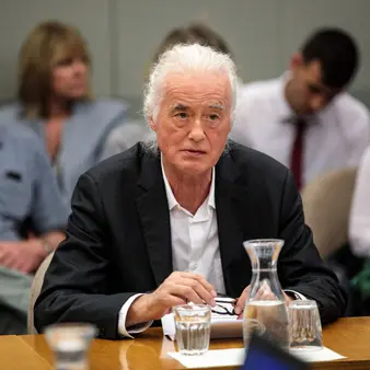 Rock Legend Jimmy Page Has Been Feuding With Singer Robbie Williams Over A "Basement Man Cave" For Ten Years Now