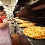 One Guy Supplies Cheese To Domino's, Pizza Hut, Papa John's… And It's Made Him A Multi-Billionaire