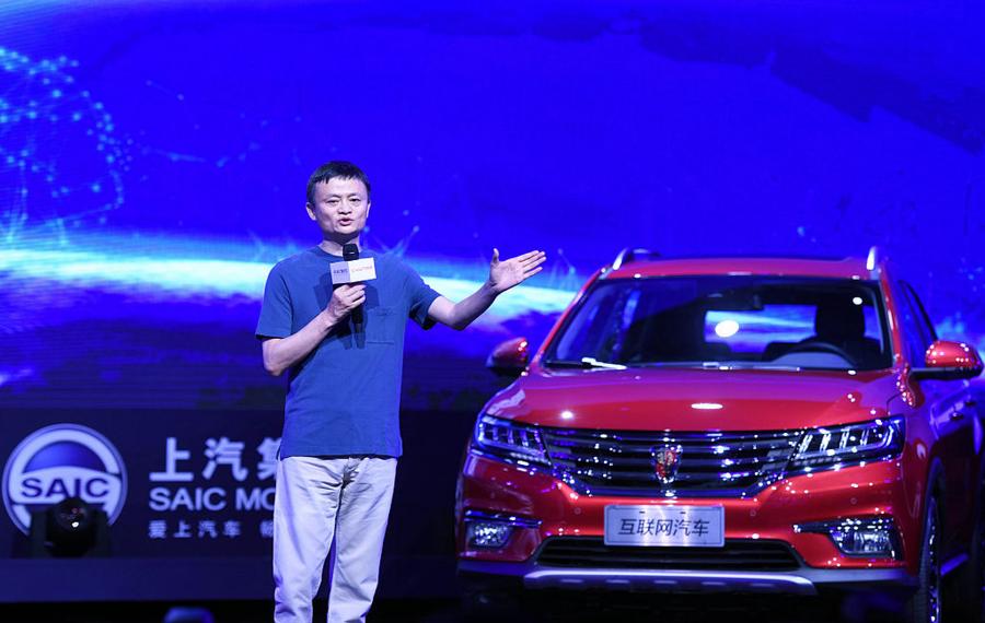 This photo taken on July 6, 2016 shows Jack Ma, Alibaba's founder and chairman, speaking during a launch event for the Roewe RX5 car in Hangzhou, in eastern China's Zhejiang province. E-commerce giant Alibaba and SAIC Motor launched a new internet-enabled vehicle, equipped with the e-commerce giant's YunOS operating system on July 6. / AFP / STR / China OUT (Photo credit should read STR/AFP/Getty Images)