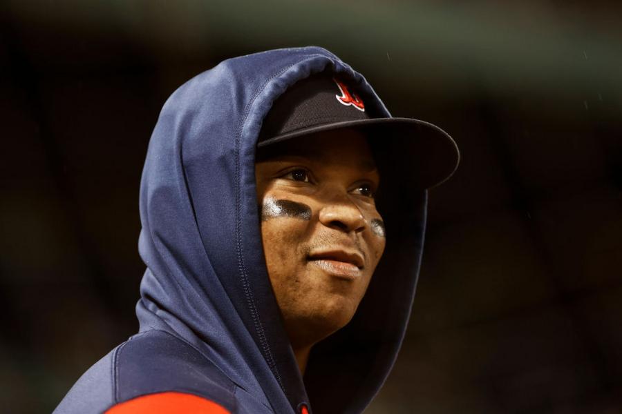 Rafael Devers stares down Cal Quantrill on his way back to the