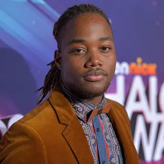 Leon Thomas III posing for a photo, giving a glimpse into his personality and career