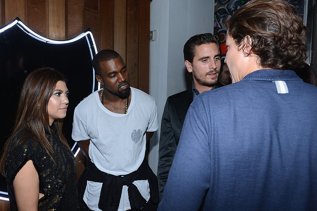 MIAMI BEACH, FL - DECEMBER 06: Kourtney Kardashian and Kanye West and Scott Disick attend the celebration of Dom Perignon Luminous Rose at Wall at W Hotel on December 6, 2012 in Miami Beach, Florida. (Photo by Dimitrios Kambouris/Getty Images for Dom Perignon)